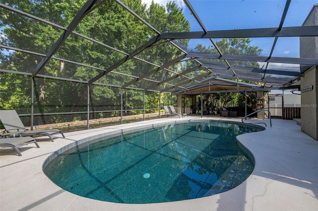 outdoor pool with a lanai, a gazebo, and a patio area