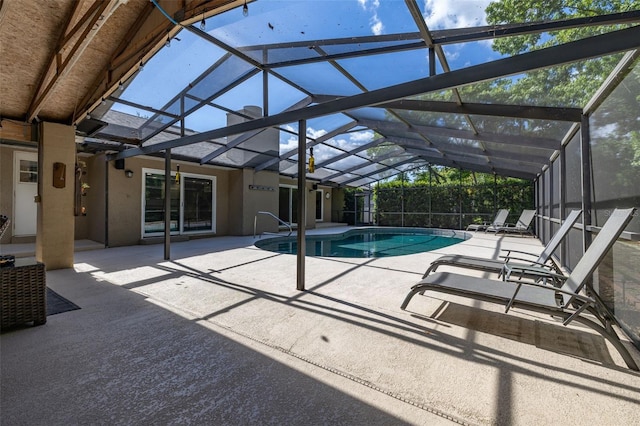 outdoor pool featuring a patio and a lanai
