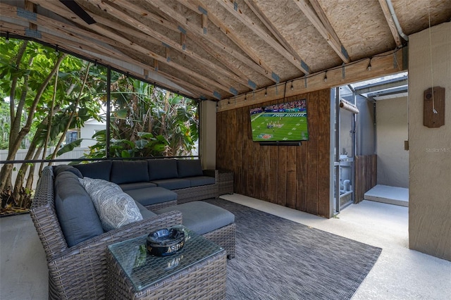 cinema room featuring lofted ceiling