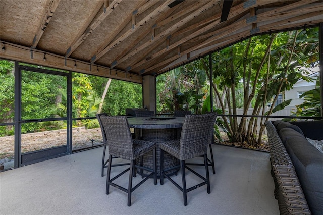 sunroom / solarium with outdoor dining area