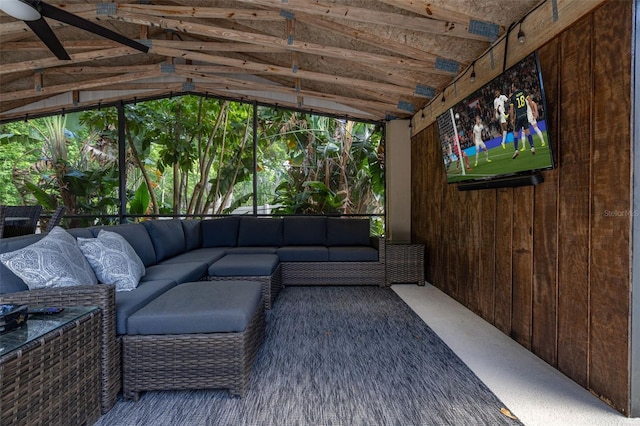 sunroom featuring outdoor lounge area and a ceiling fan