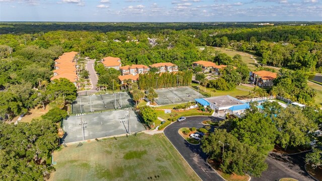 drone / aerial view featuring a view of trees
