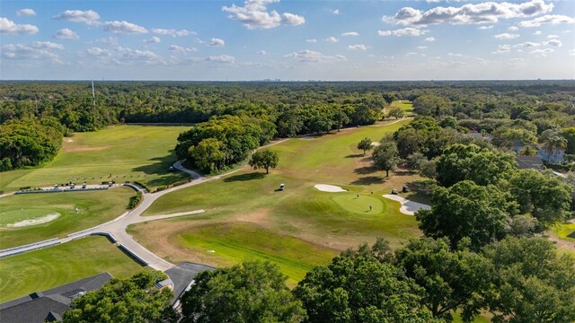 aerial view featuring a view of trees and golf course view