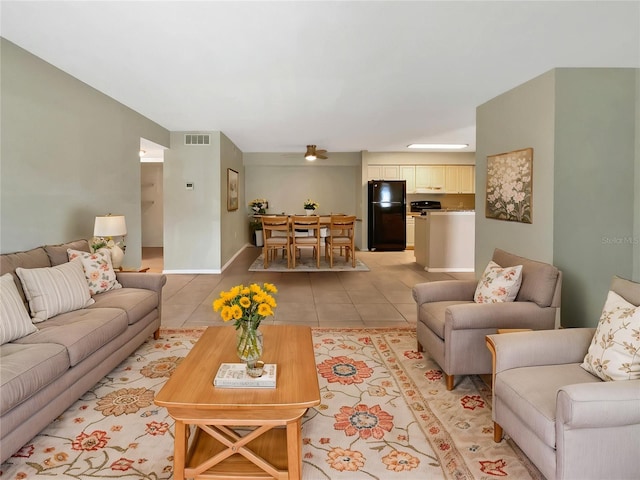 living room featuring visible vents and light tile patterned floors