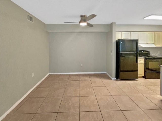 kitchen with visible vents, light tile patterned floors, under cabinet range hood, and black appliances