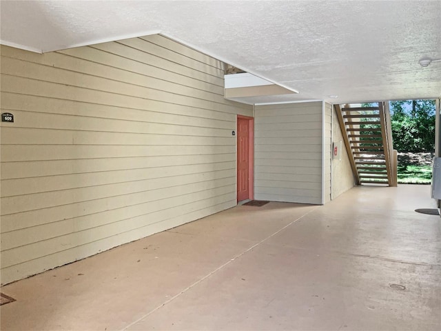 view of exterior entry featuring a patio area