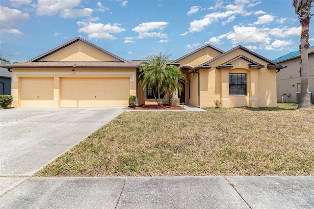 ranch-style home with driveway, a front yard, a garage, central air condition unit, and stucco siding