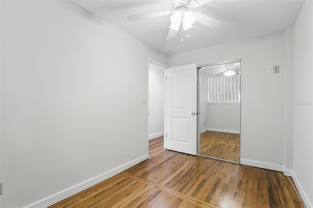 320 Lakeview St Unit 222, Orlando, FL 32804 - unfurnished bedroom featuring wood-type flooring, baseboards, ceiling fan, and a closet