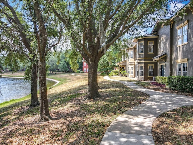 surrounding community with a water view