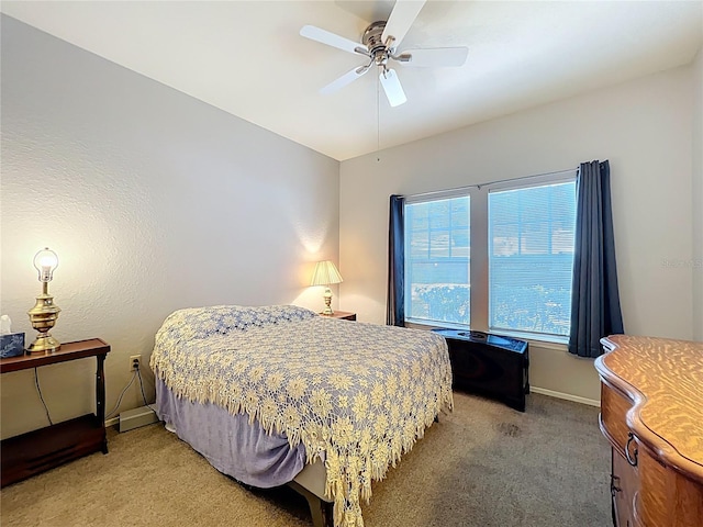 bedroom with baseboards, light carpet, and ceiling fan