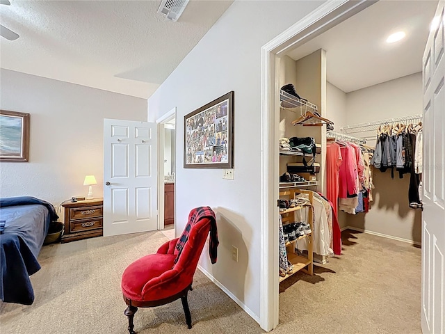 bedroom featuring carpet flooring, baseboards, visible vents, and a closet