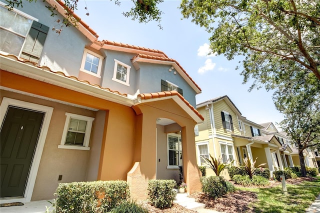7348 Yoder St, Windermere, FL 34786 - view of front of property featuring stucco siding and a tiled roof