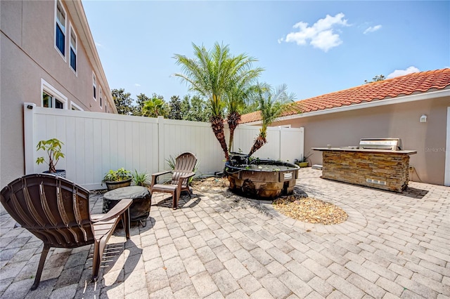 7348 Yoder St, Windermere, FL 34786 - view of patio featuring exterior kitchen and a fenced backyard