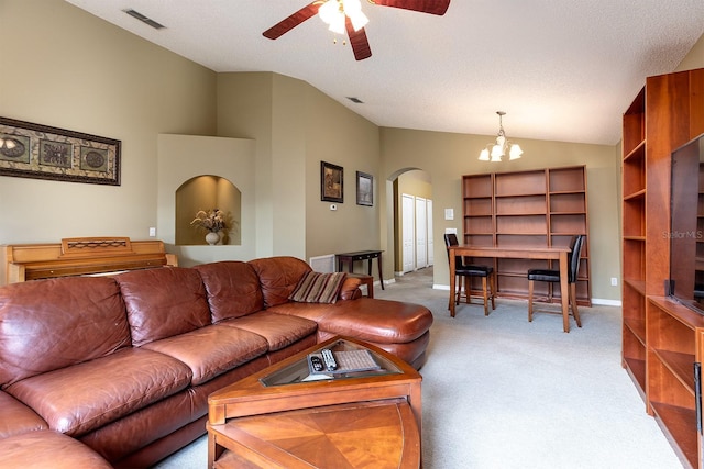 living area featuring visible vents, arched walkways, lofted ceiling, and light carpet