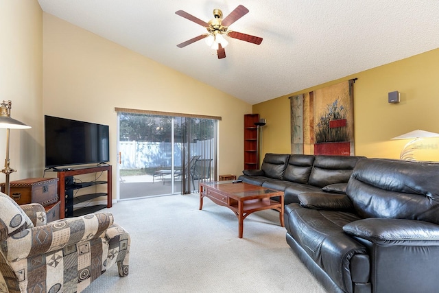 carpeted living room featuring ceiling fan and vaulted ceiling