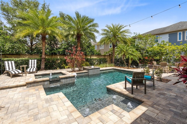 8263 Bellow St, Orlando, FL 32827 - view of pool featuring a fenced backyard, a patio area, and a pool with connected hot tub