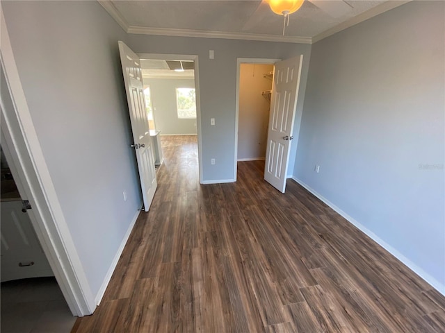122 Water Front Way Unit 360, Altamonte Springs, FL 32701 - unfurnished bedroom with crown molding, baseboards, a spacious closet, and dark wood-type flooring
