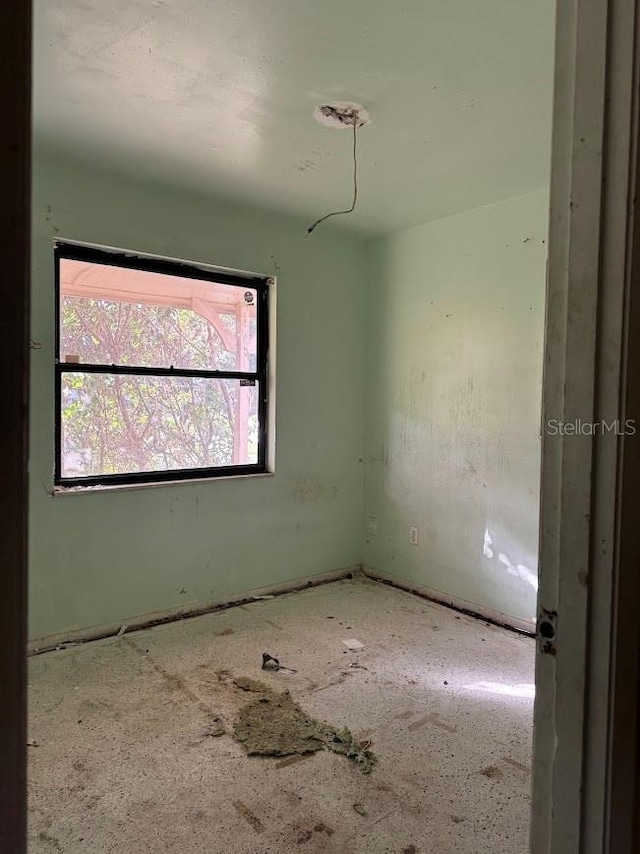 spare room with a wealth of natural light