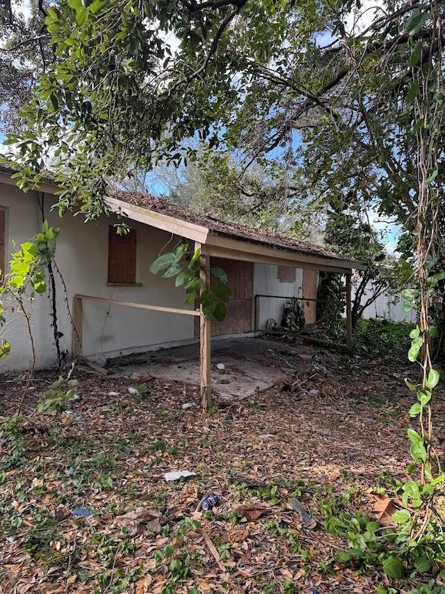 view of side of property featuring stucco siding