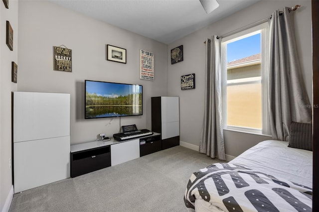 bedroom with carpet flooring and baseboards