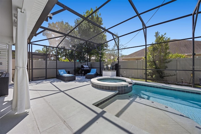 view of swimming pool with a patio, a pool with connected hot tub, a lanai, and fence private yard