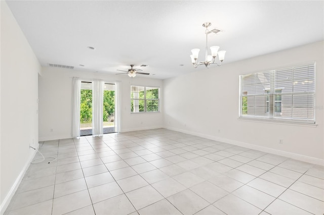 3128 Oxbow Ct, Harmony, FL 34773 - empty room featuring baseboards, visible vents, light tile patterned floors, and ceiling fan with notable chandelier