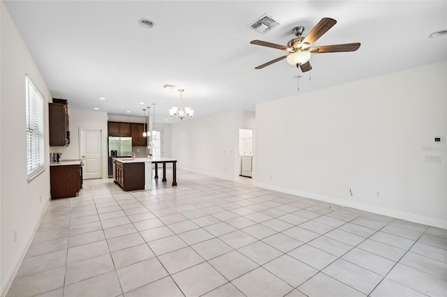 3128 Oxbow Ct, Harmony, FL 34773 - unfurnished living room with ceiling fan with notable chandelier, recessed lighting, baseboards, light tile patterned floors, and visible vents
