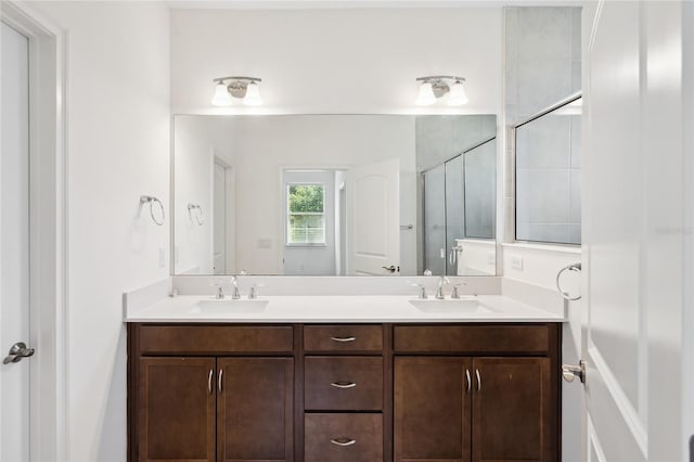 3128 Oxbow Ct, Harmony, FL 34773 - bathroom with a sink, a shower stall, and double vanity