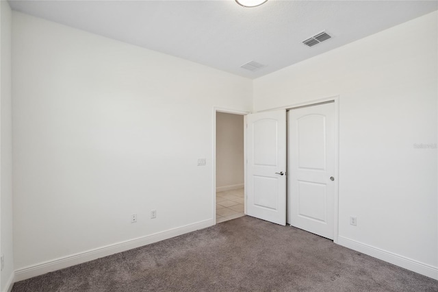 3128 Oxbow Ct, Harmony, FL 34773 - unfurnished bedroom featuring carpet floors, baseboards, a closet, and visible vents
