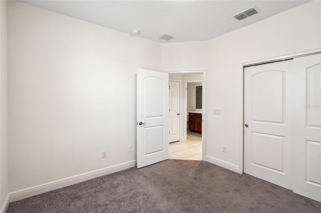 3128 Oxbow Ct, Harmony, FL 34773 - unfurnished bedroom with a closet, baseboards, light colored carpet, and visible vents