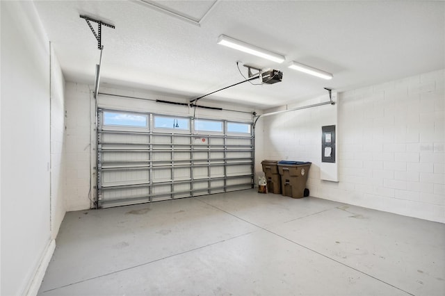 3128 Oxbow Ct, Harmony, FL 34773 - garage featuring concrete block wall, a garage door opener, and electric panel