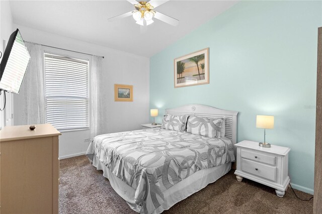 carpeted bedroom with baseboards, ceiling fan, and lofted ceiling