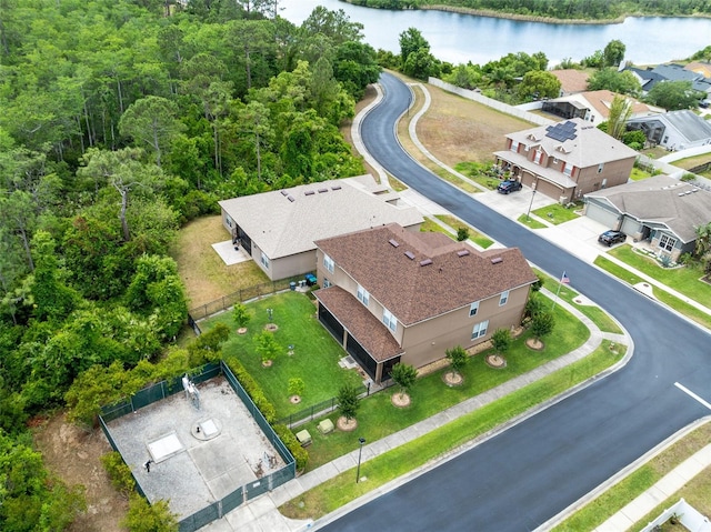 bird's eye view with a water view and a forest view