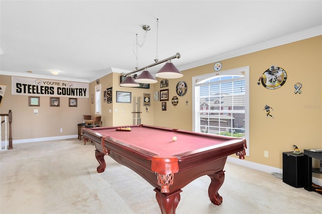 recreation room with pool table, ornamental molding, baseboards, and light carpet