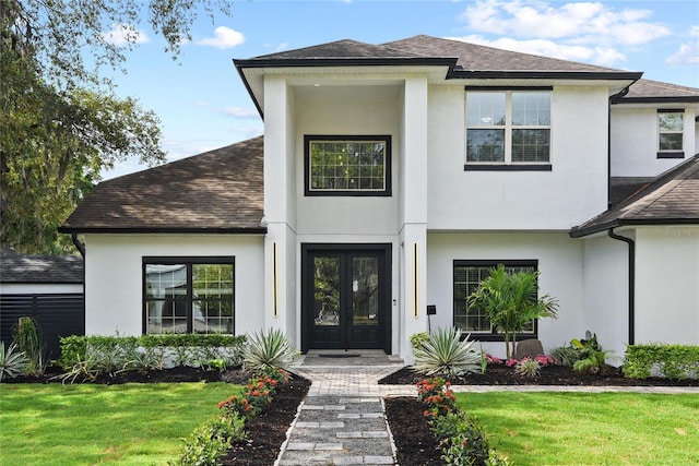 1840 Bryan Ave, Winter Park, FL 32789 - view of front of property with french doors, a front lawn, roof with shingles, and stucco siding