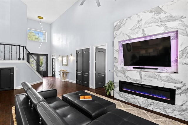 1840 Bryan Ave, Winter Park, FL 32789 - living area with wood finished floors, a premium fireplace, high vaulted ceiling, and stairway
