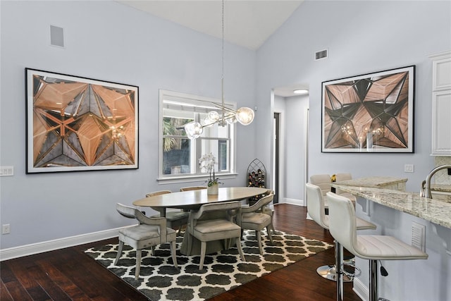 1840 Bryan Ave, Winter Park, FL 32789 - dining room featuring baseboards, dark wood finished floors, an inviting chandelier, and visible vents
