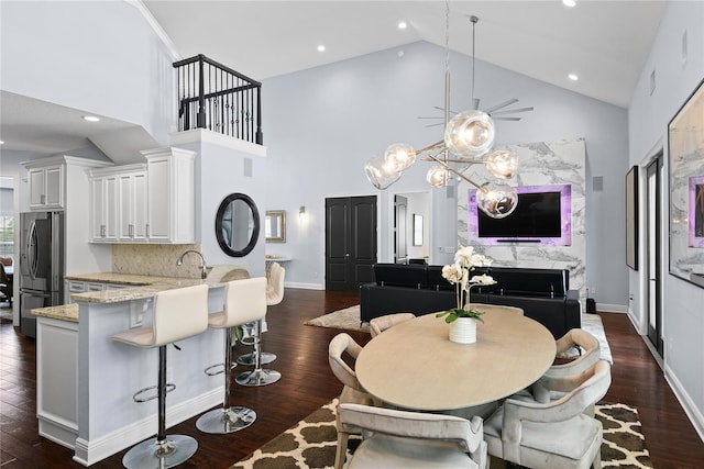 1840 Bryan Ave, Winter Park, FL 32789 - dining room with recessed lighting, high vaulted ceiling, dark wood-style floors, and baseboards