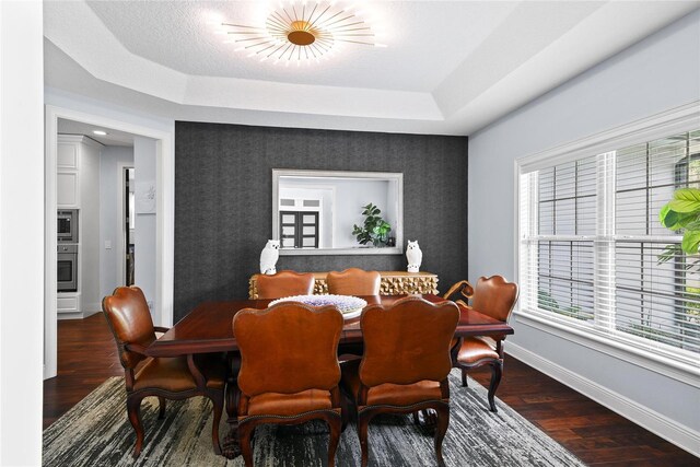 1840 Bryan Ave, Winter Park, FL 32789 - dining area with baseboards, a raised ceiling, wood finished floors, and wallpapered walls