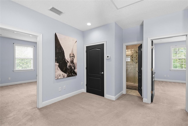1840 Bryan Ave, Winter Park, FL 32789 - unfurnished bedroom with baseboards, carpet, ensuite bath, and visible vents