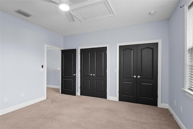 1840 Bryan Ave, Winter Park, FL 32789 - unfurnished bedroom featuring carpet flooring, a textured ceiling, visible vents, and ceiling fan