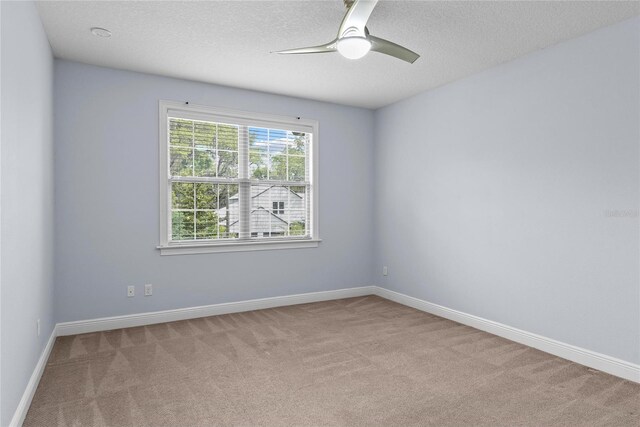 1840 Bryan Ave, Winter Park, FL 32789 - carpeted spare room featuring baseboards, a textured ceiling, and ceiling fan