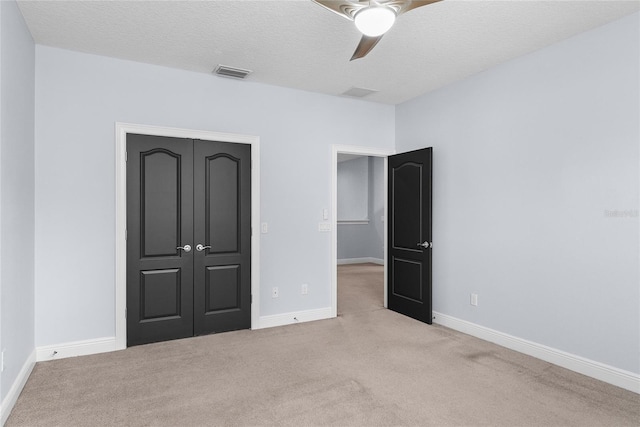 1840 Bryan Ave, Winter Park, FL 32789 - unfurnished bedroom with ceiling fan, a textured ceiling, carpet, baseboards, and visible vents
