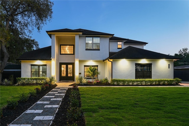 1840 Bryan Ave, Winter Park, FL 32789 - view of front of house featuring french doors, a front lawn, and stucco siding