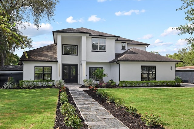 1840 Bryan Ave, Winter Park, FL 32789 - view of front of house with french doors, a shingled roof, a front yard, and stucco siding