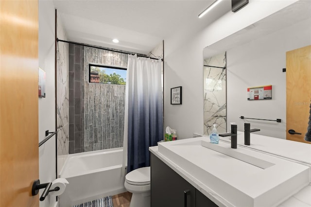 full bathroom featuring toilet, shower / bath combo, and vanity
