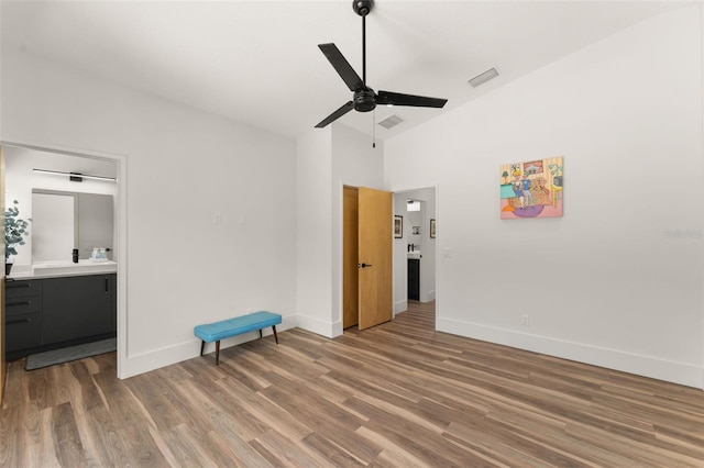 unfurnished bedroom featuring baseboards, visible vents, and wood finished floors