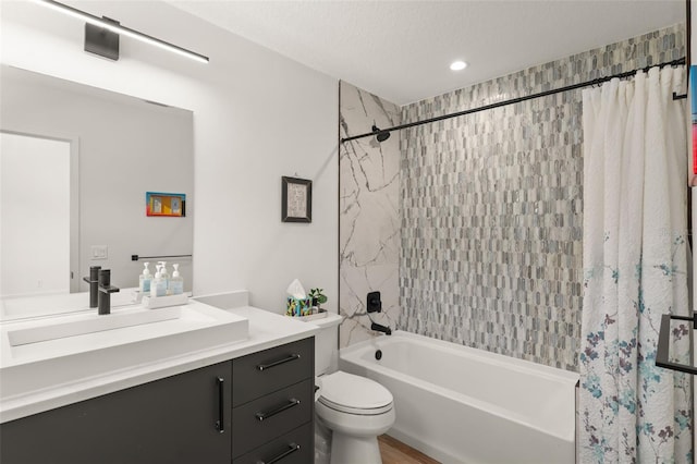 bathroom featuring toilet, recessed lighting, shower / bath combo, and vanity