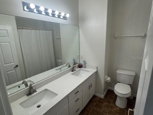 10414 Andover Point Cir, Orlando, FL 32825 - bathroom with a sink, tile patterned flooring, and toilet