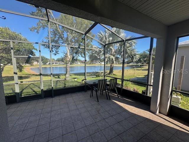10414 Andover Point Cir, Orlando, FL 32825 - sunroom / solarium featuring a water view